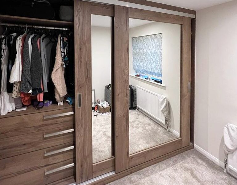 Fitted wardrobe with modern sliding doors