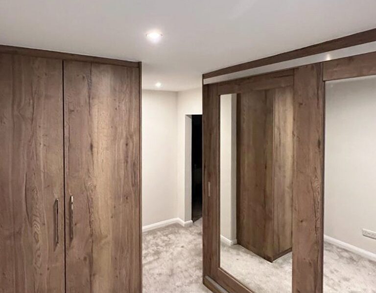 Large fitted wardrobes with sliding doors
