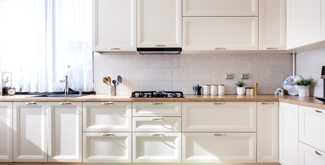 Modern kitchen interior design with white furniture and modern details